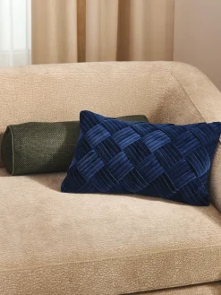 Cuscino rullo in bouclé con bordino Aya